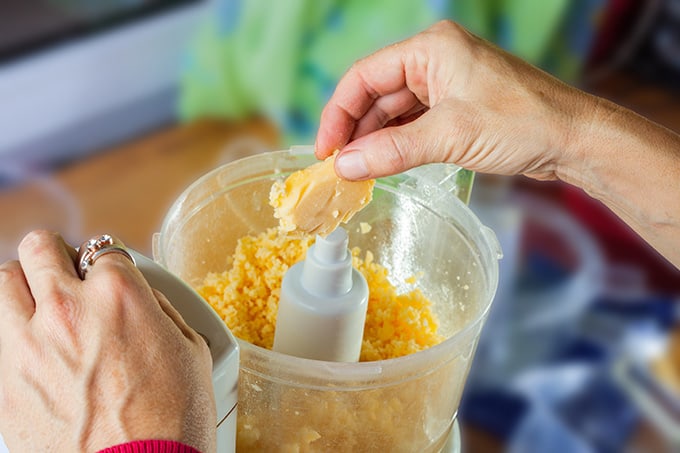 Putting food into a mini food processor