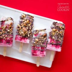 chocolate covered popsicles on a white tray