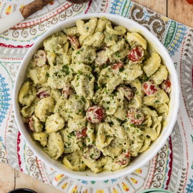 overhead view of Tortellini Pesto Pasta Salad in serving bowl