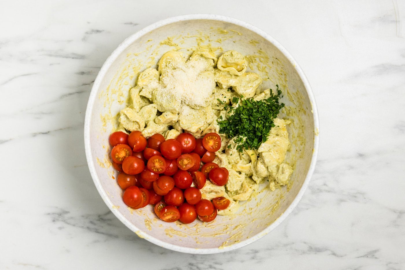 Tortellini Pesto Pasta Salad ingredients in bowl