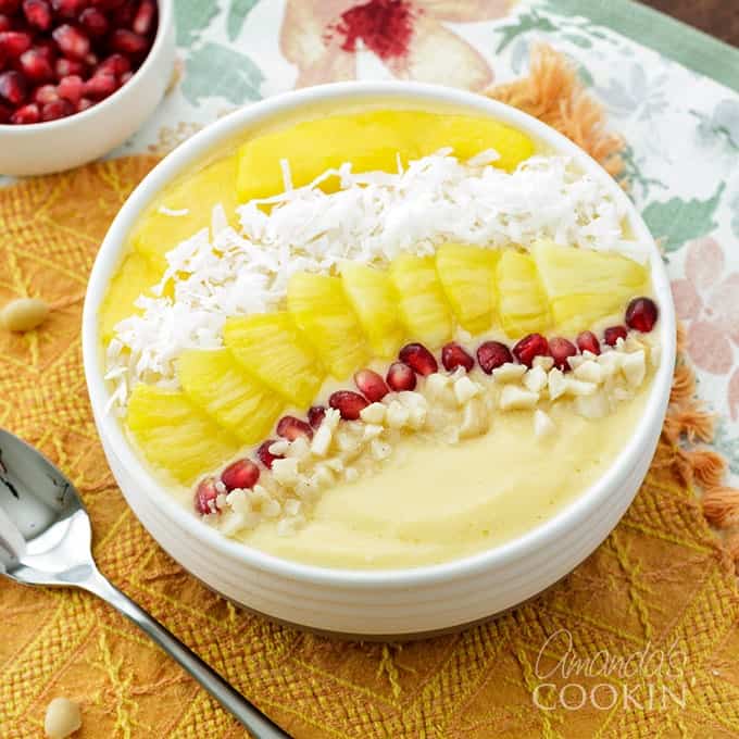 smoothie bowl with pomegranate, coconut, pineapple, and mango