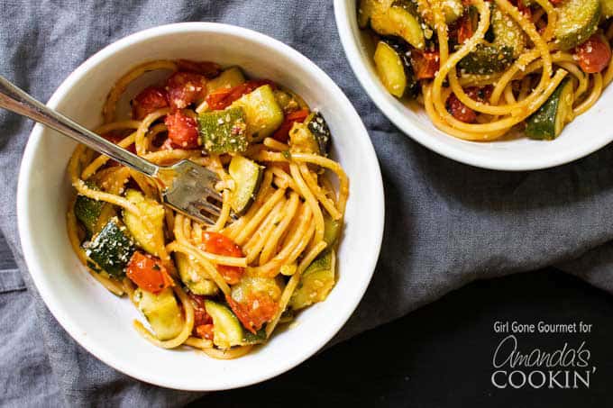 Zucchini and Tomato Pasta in a bowl with a fork