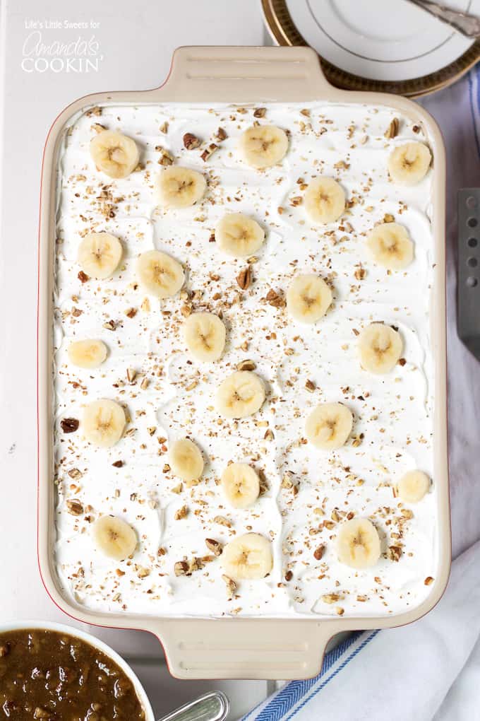 dessert topped with bananas in a baking pan