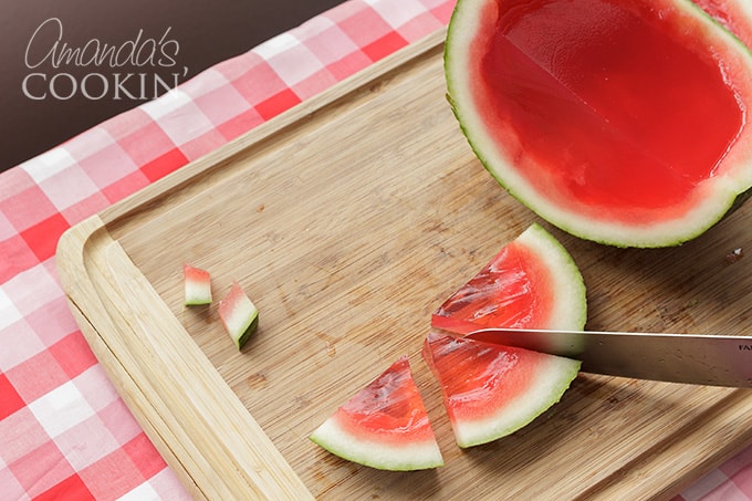 slicing watermelon jello shots