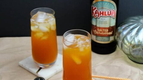 two tall cocktails with Kahlua in background