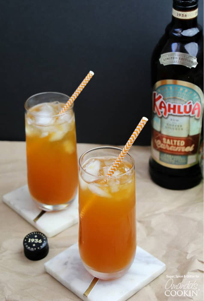 Caramel Pumpkin Cocktails in glasses with striped straws and Kahlua