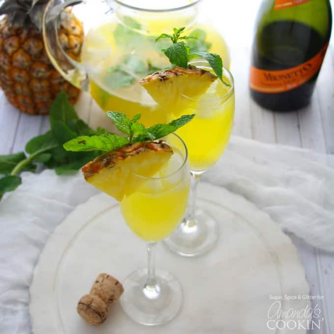 Pineapple Prosecco Punch in champagne flutes