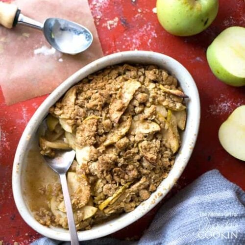 apple crisp in dish with a spoon