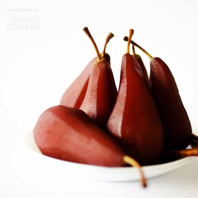 several stewed pears on a plate