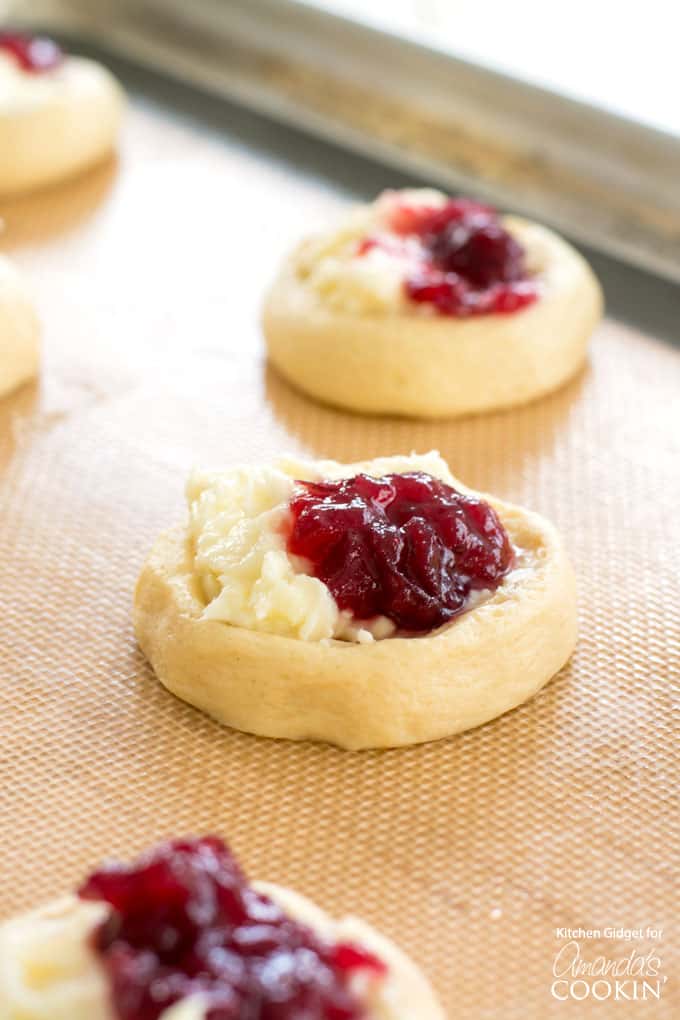 cream cheese and cranberry on top of dough