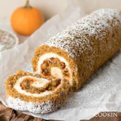 pumpkin roll with a slice off of it