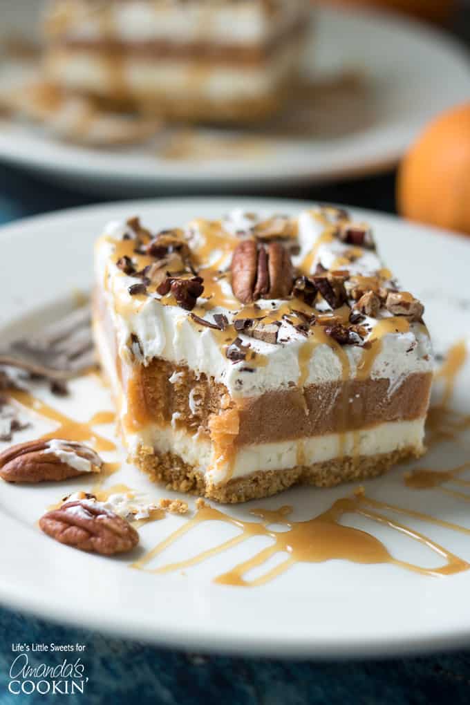 slice of pumpkin dessert with a bite out of it on plate