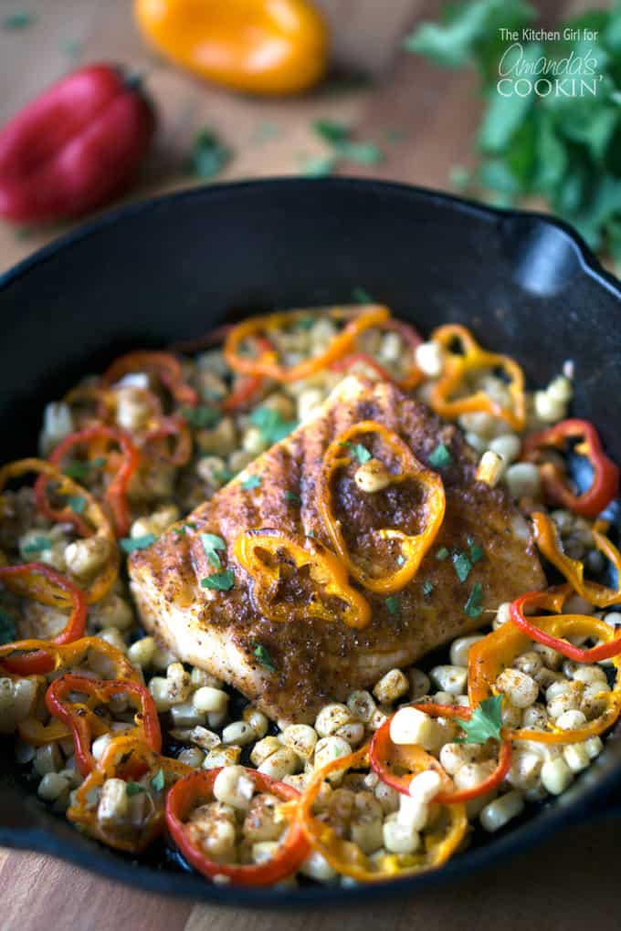 cast iron pan with cod and vegetables