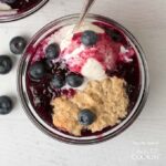 bowl of blueberry cobbler with ice cream