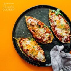 cooked eggplant on a black plate