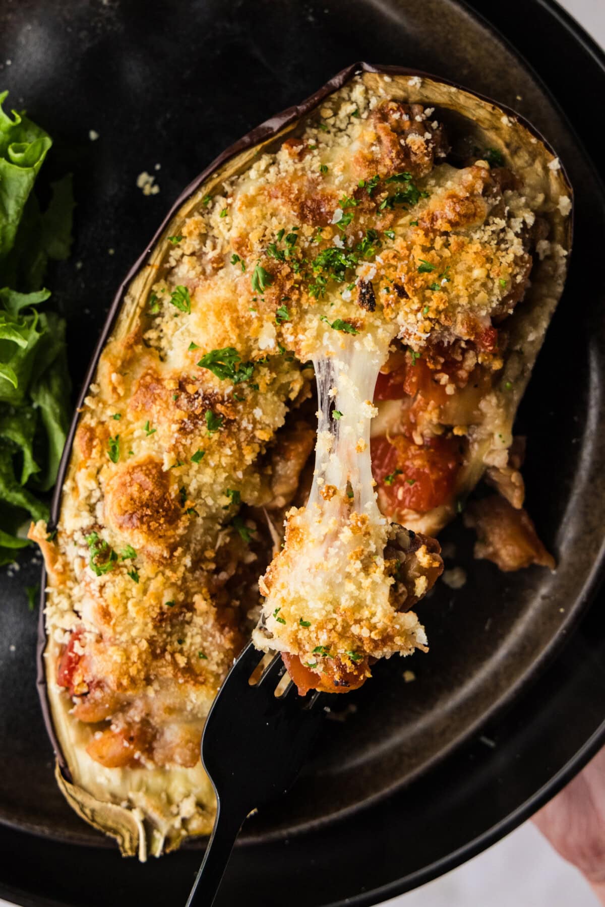 cheese pull from panko topped stuffed baked eggplant parmesan