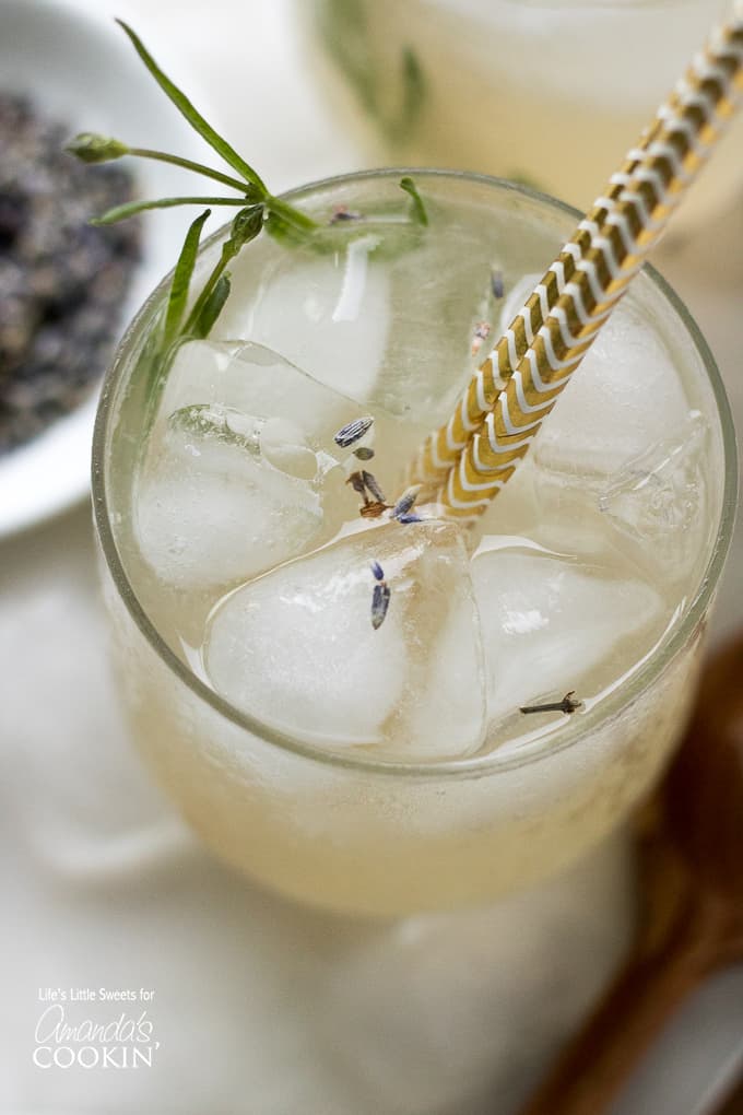 overhead view of lemonade in glass with lavender leaves