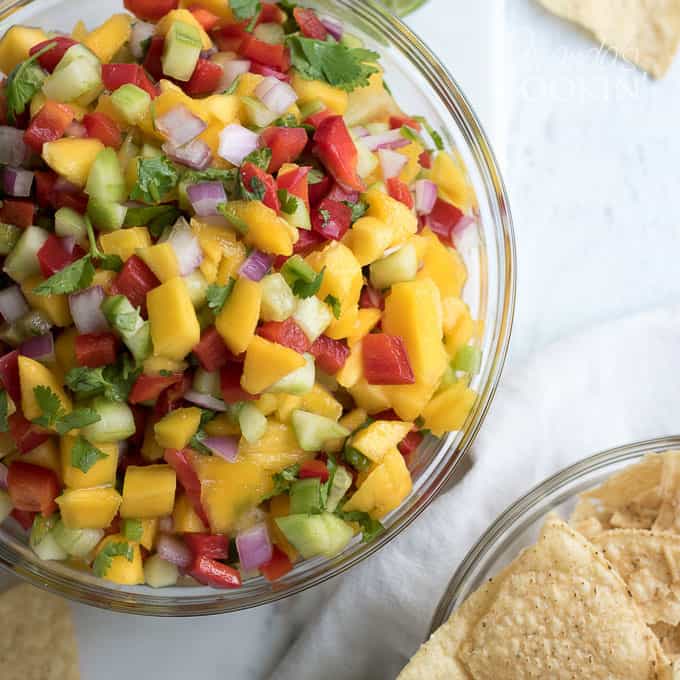 A photo of pineapple salsa in a clear bowl.