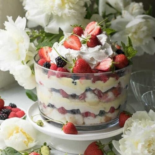 berry trifle with flowers in the background