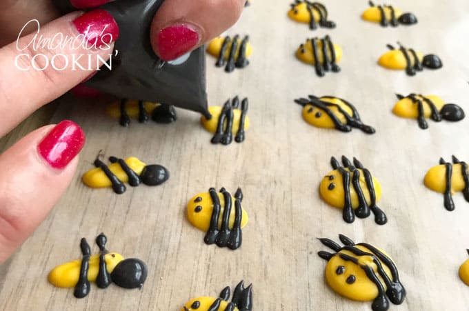 Add eyes to candy melt bees