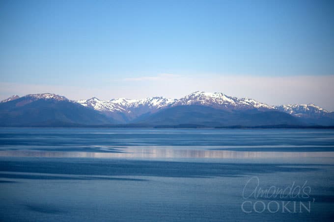 water in foreground, mountains in background