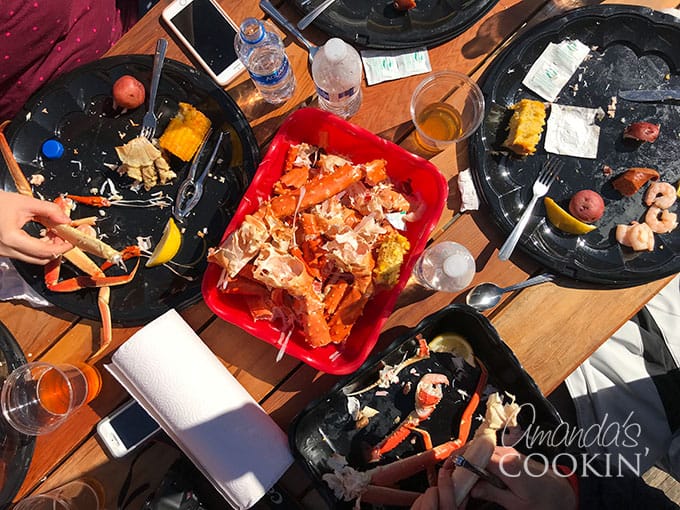 Food on a table including cracked crab legs