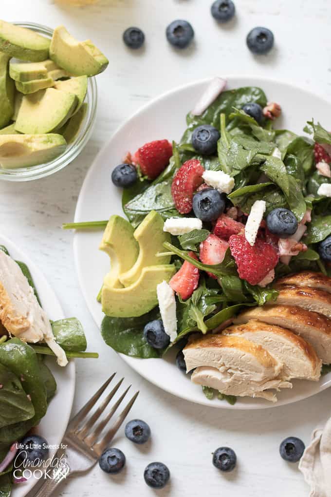Strawberry salad with blueberries, avocado and chicken.