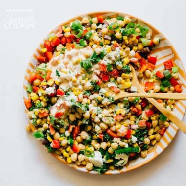 colorful salad on a plate with spoons