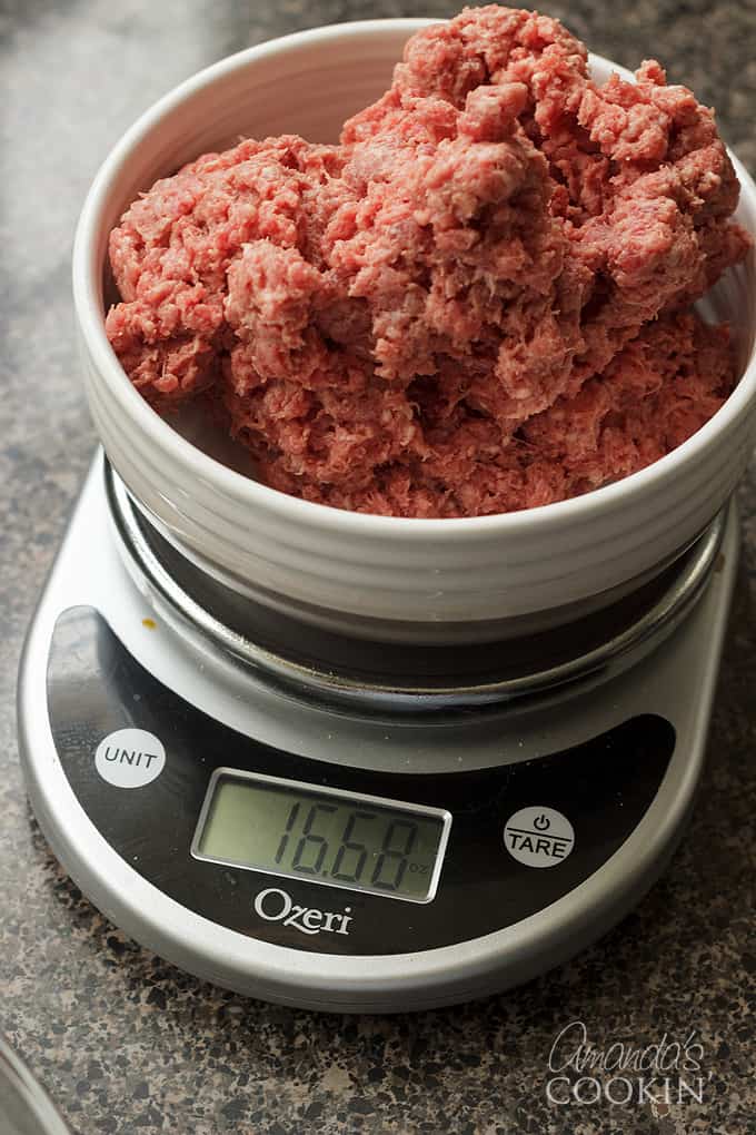 ground beef getting weighed on kitchen scale