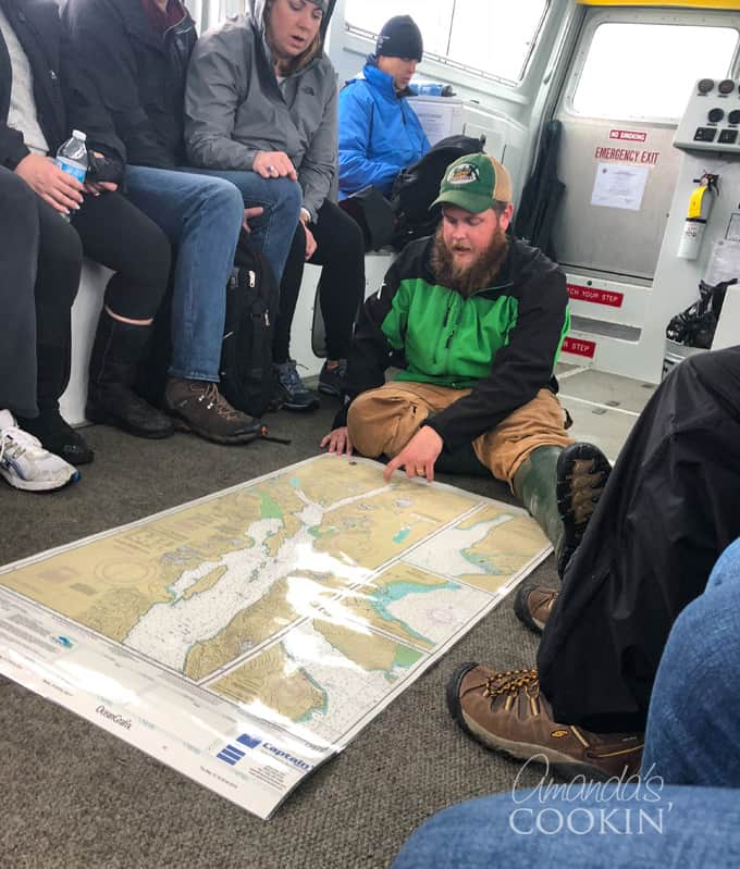 excursion guide looking at map