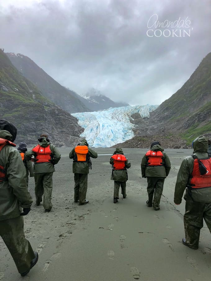 walk across black sand beach to davidson glacier in skagway, alaska