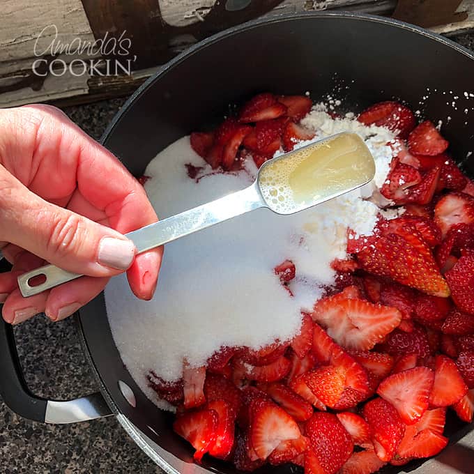 ingredients for strawberry sauce in pan