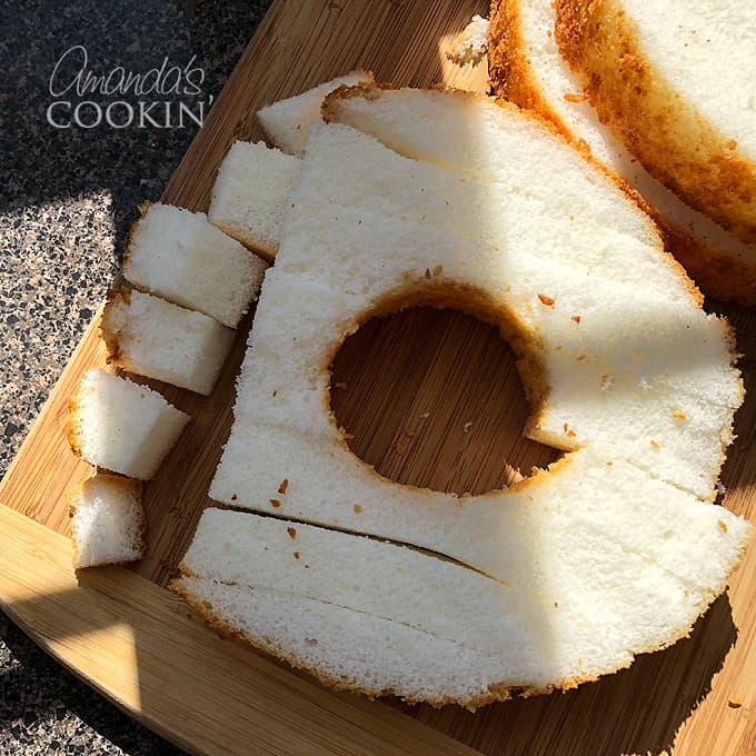 cutting angel food cake into cubes