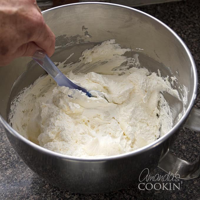 folding whipped cream into cream cheese mixture