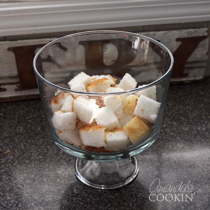 angel food cake cubes in a trifle bowl