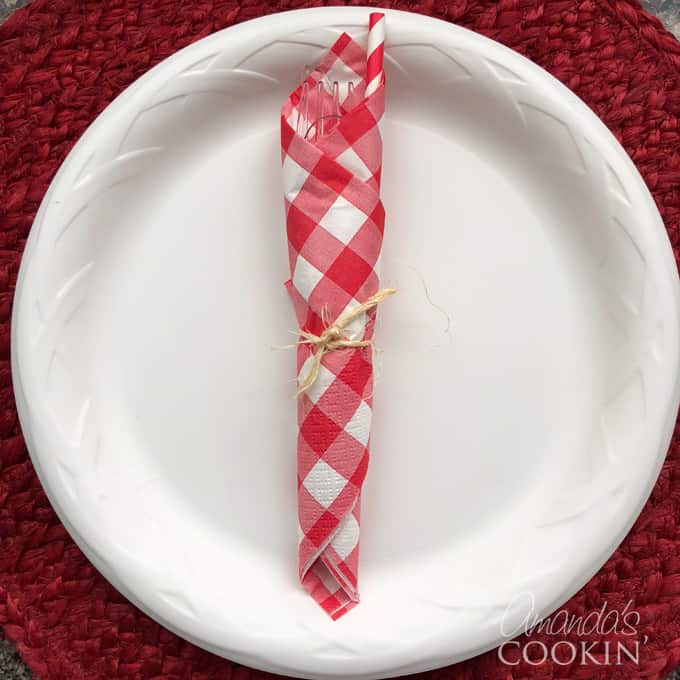 cute napkin wrapped utensils for backyard barbecue
