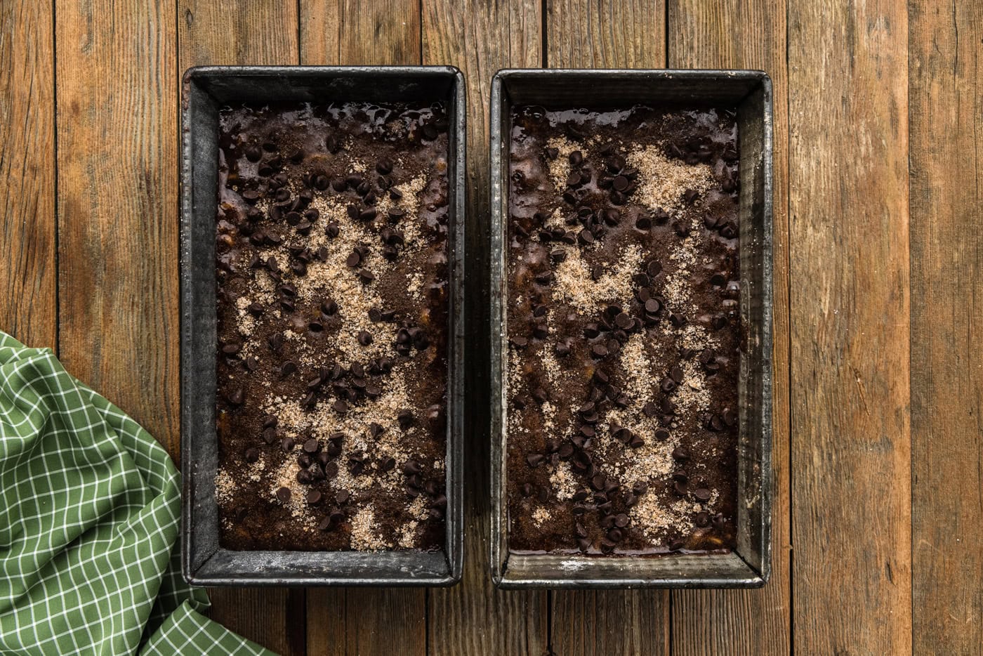 batter for Double Chocolate Zucchini Bread in pans with sugar mixture on top