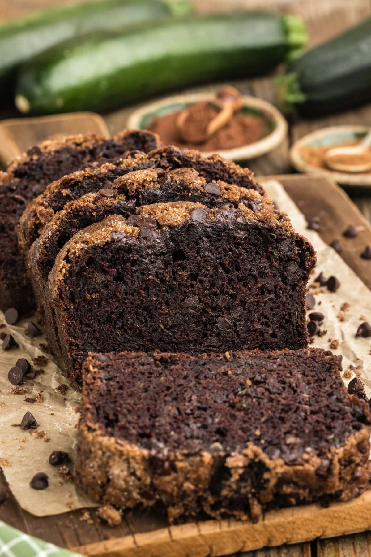 Double Chocolate Zucchini Bread sliced on parchment paper