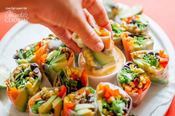 Mexican style summer rolls dipped into smoky chipotle sauce