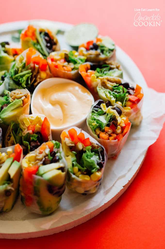 Mexican Style Summer Rolls on a plate with dipping sauce