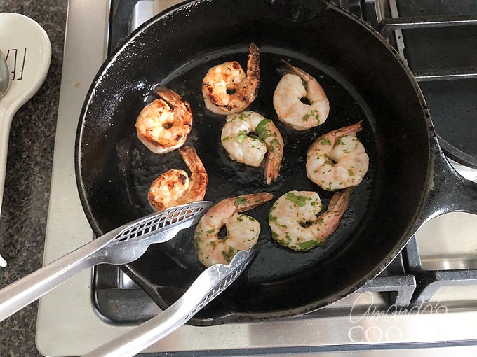 turning shrimp in skillet