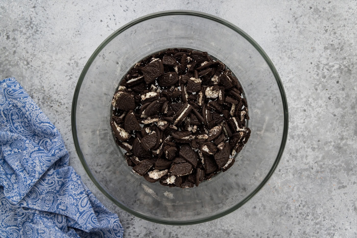 broken oreo cookies in the bottom of a trifle bowl