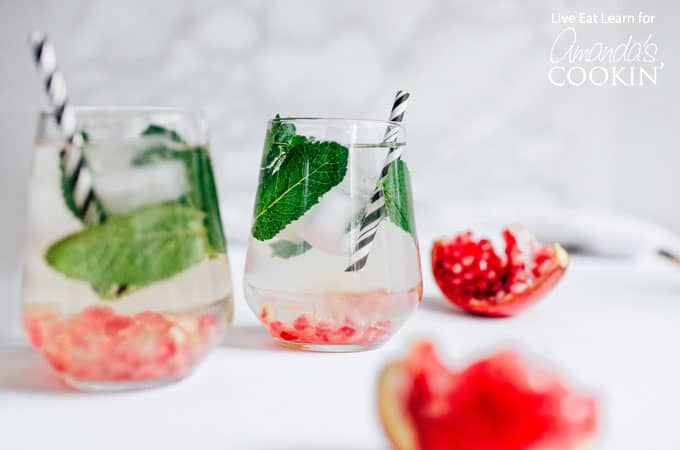 Holiday Detox Drinks in glasses with mint and cranberry 