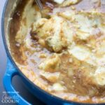 mashed potatoes with gravy in a blue pot