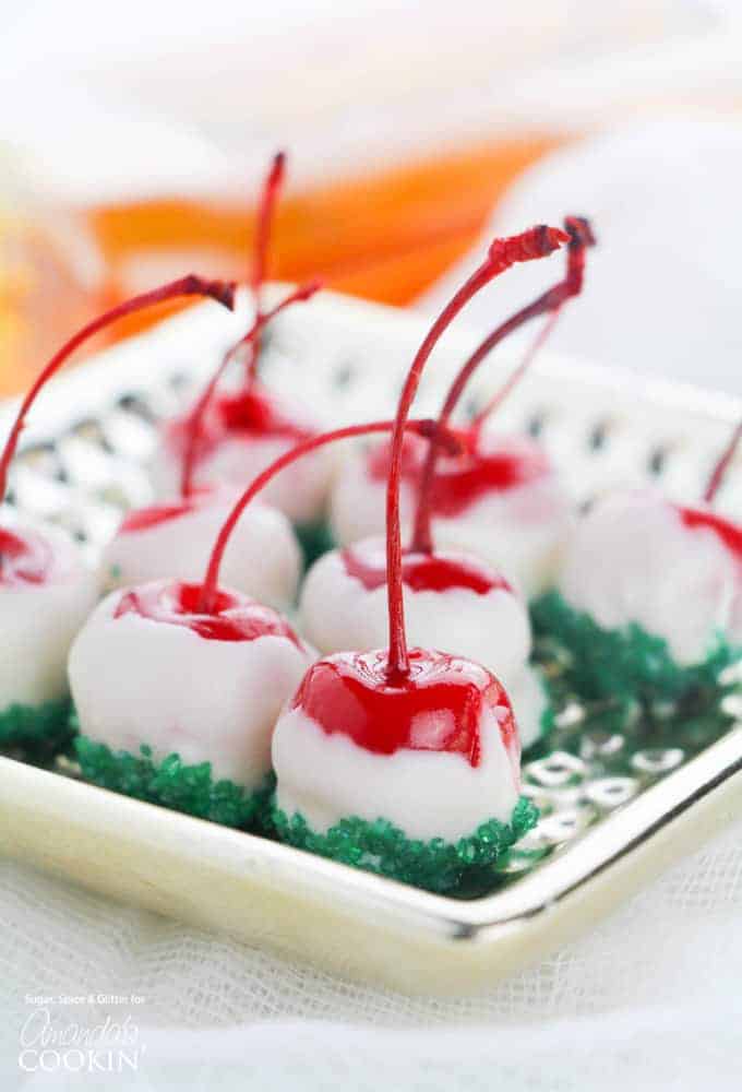 spiked cherries with white chocolate and green sprinkles
