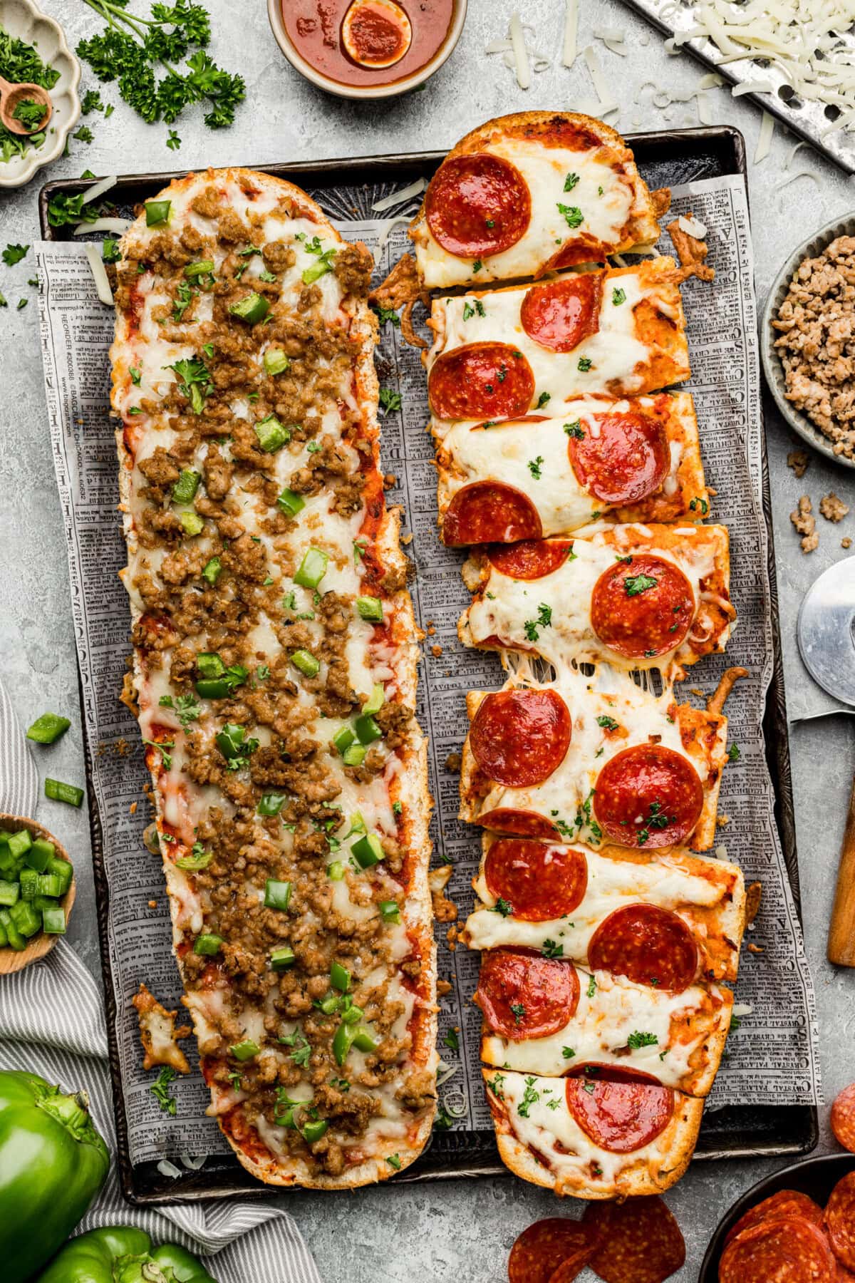 overhead photo of french bread pizza on a baking sheet