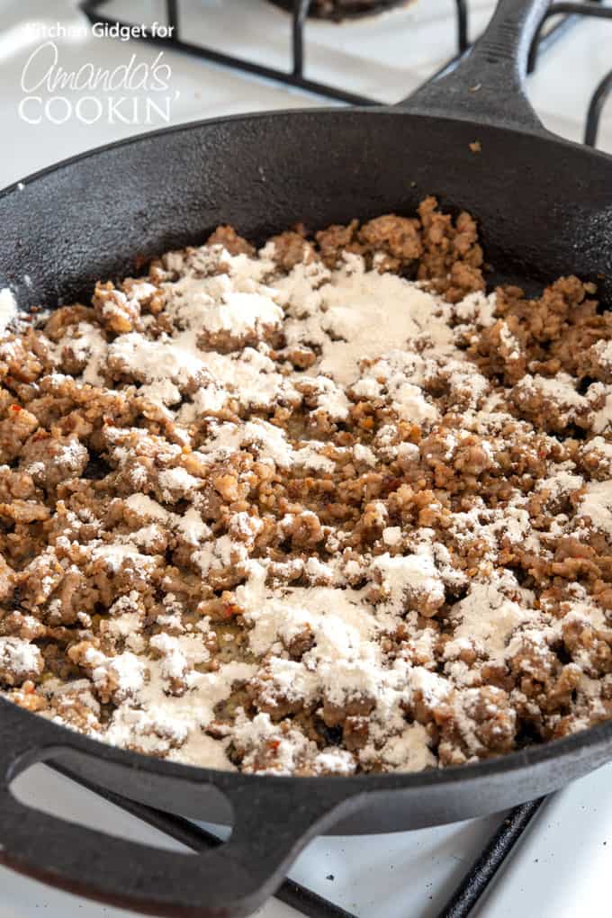 sausage gravy being cooked with flour