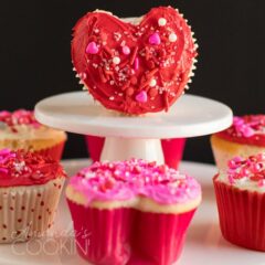 red heart cupcake standing on its side