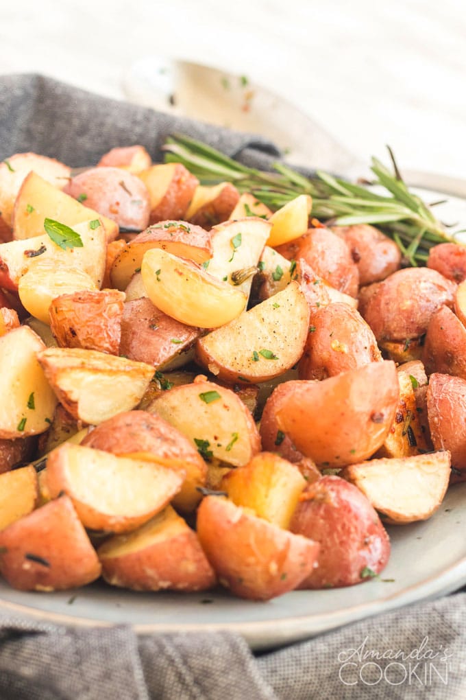dish of roasted potatoes garnished with rosemary