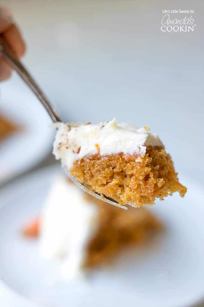 forkful of carrot cake with cream cheese frosting